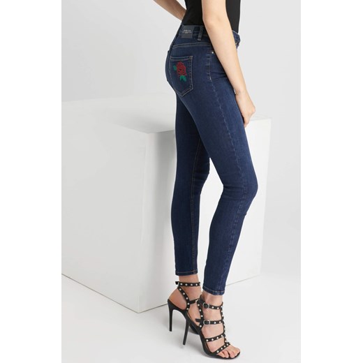 Jeansy skinny z haftem i ćwiekami