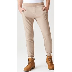 Beżowe spodnie męskie Sinsay jesienne dresowe  - zdjęcie produktu