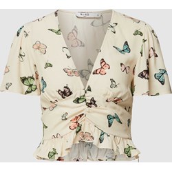 Bluzka damska NA-KD z krótkim rękawem z wiskozy beżowa casualowa z dekoltem v w kwiaty  - zdjęcie produktu