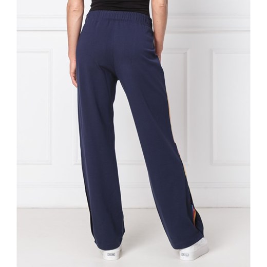 Tommy Jeans Spodnie dresowe TJW TOMMY POPPER | flare fit Tommy Jeans L Gomez Fashion Store wyprzedaż