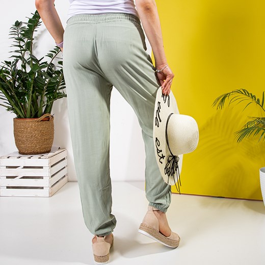 Zielone damskie materiałowe spodnie PLUS SIZE - Odzież Royalfashion.pl 6XL/7XL royalfashion.pl