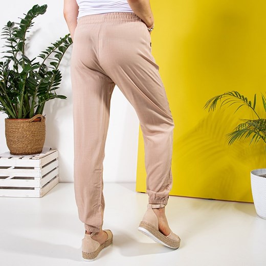 Beżowe damskie materiałowe spodnie PLUS SIZE - Odzież Royalfashion.pl 5XL/6XL royalfashion.pl