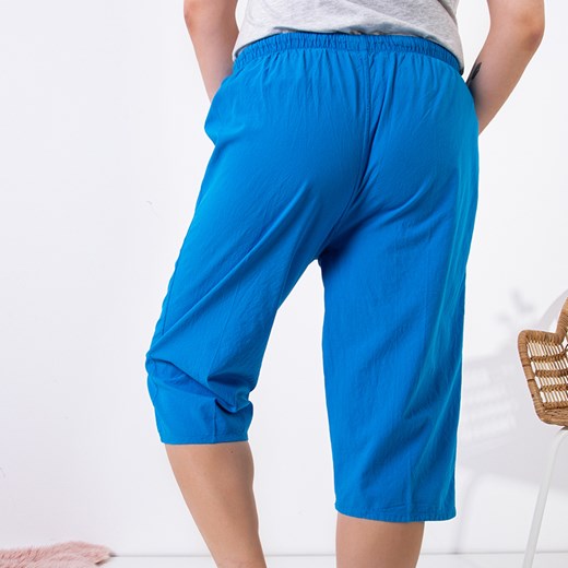 Niebieskie damskie proste spodnie o długości 3/4 PLUS SIZE - Odzież Royalfashion.pl XL - 42 royalfashion.pl