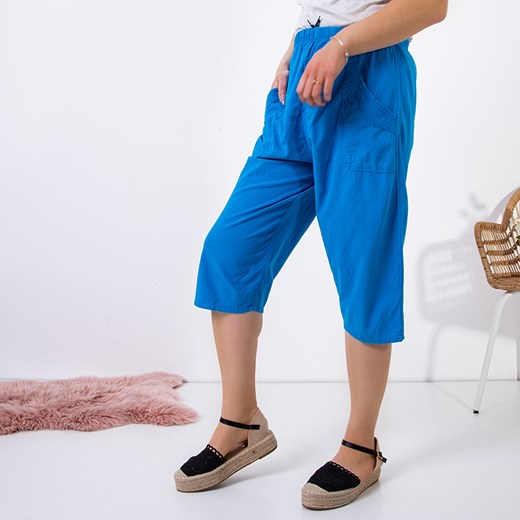 Niebieskie damskie proste spodnie o długości 3/4 PLUS SIZE - Odzież Royalfashion.pl 5XL-50 royalfashion.pl