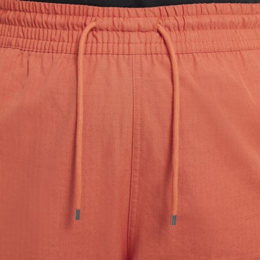 Spodnie damskie Nike pomarańczowe 