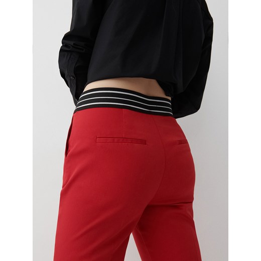 Reserved - Eleganckie spodnie slim fit - Czerwony Reserved 38 Reserved okazja