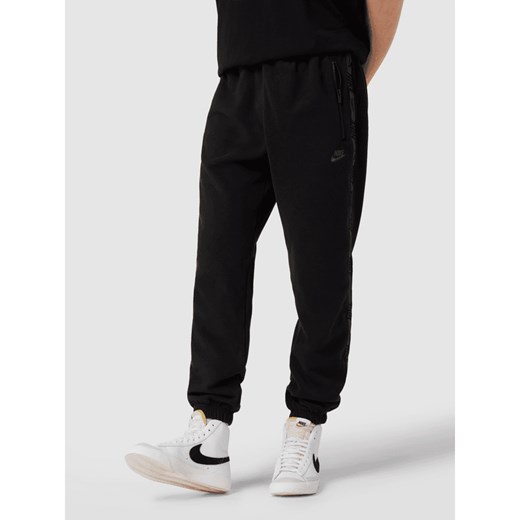 Spodnie dresowe z lampasami Nike XS Peek&Cloppenburg 