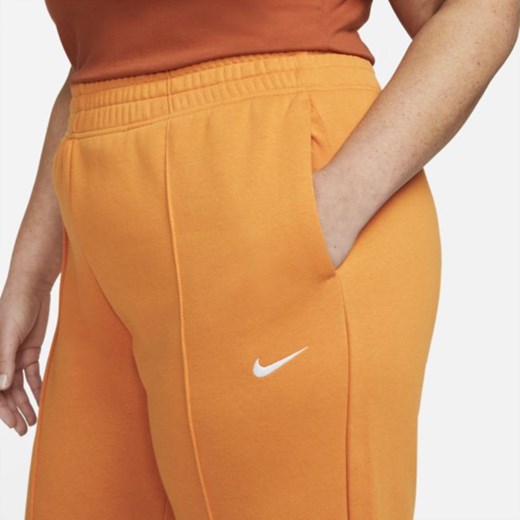 Spodnie damskie pomarańczowe Nike z dzianiny 