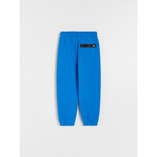 Reserved - Dresowe spodnie z kieszeniami - Niebieski Reserved 140 Reserved