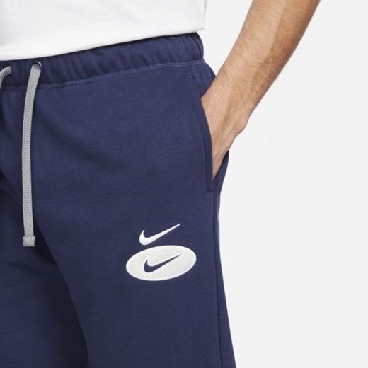 Męskie joggery z dzianiny dresowej Nike Sportswear Swoosh League - Niebieski Nike L promocyjna cena Nike poland