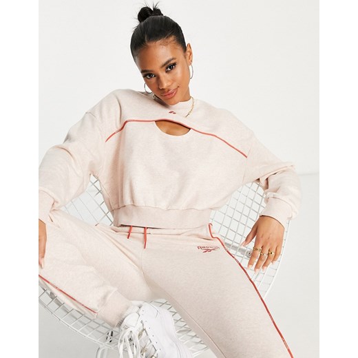 Reebok – Bladoróżowa bluza dresowa z lamówką i wycięciami-Różowy Reebok L Asos Poland