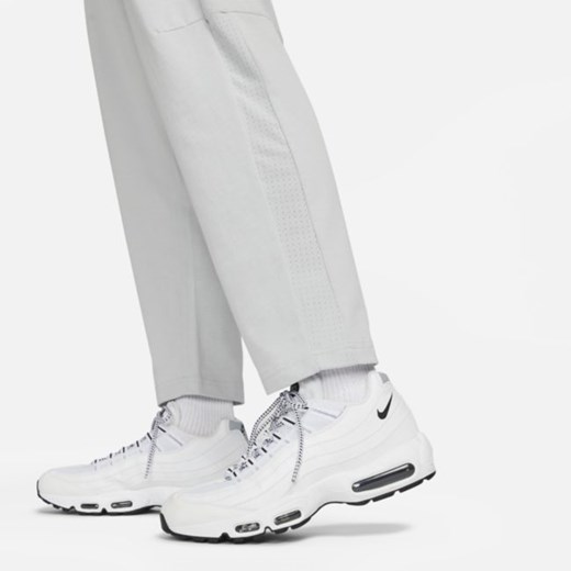 Męskie lekkie spodnie z luźnymi nogawkami Nike Sportswear - Szary Nike L Nike poland