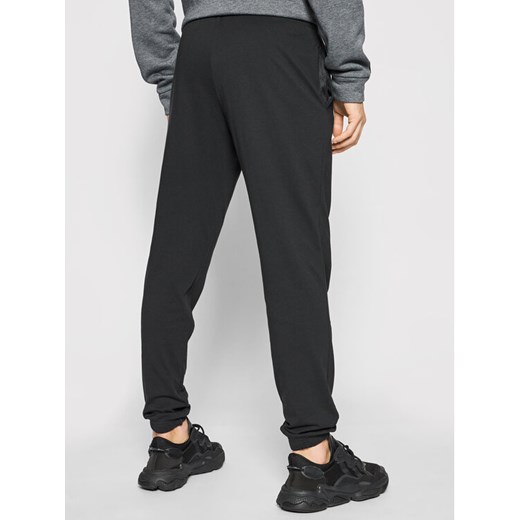 adidas Spodnie dresowe Essentials Single Jersey GK8827 Czarny Regular Fit M MODIVO