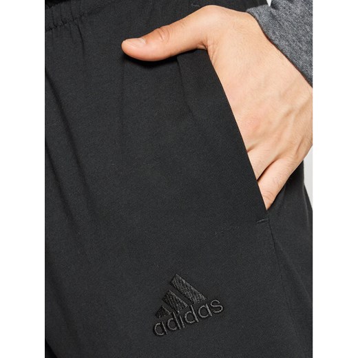 adidas Spodnie dresowe Essentials Single Jersey GK8827 Czarny Regular Fit L MODIVO