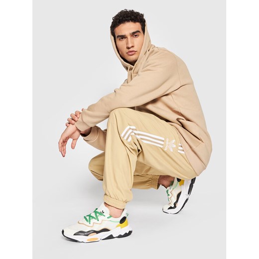 adidas Spodnie dresowe adicolor Classics Lock-Up Trefoil H41385 Beżowy Regular 2XL MODIVO okazja