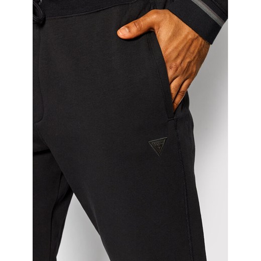 Guess Spodnie dresowe M1BB37 K7ON1 Czarny Slim Fit Guess XL MODIVO wyprzedaż