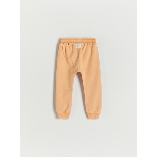 Reserved - Bawełniane spodnie z kieszeniami - Pomarańczowy Reserved 110 Reserved