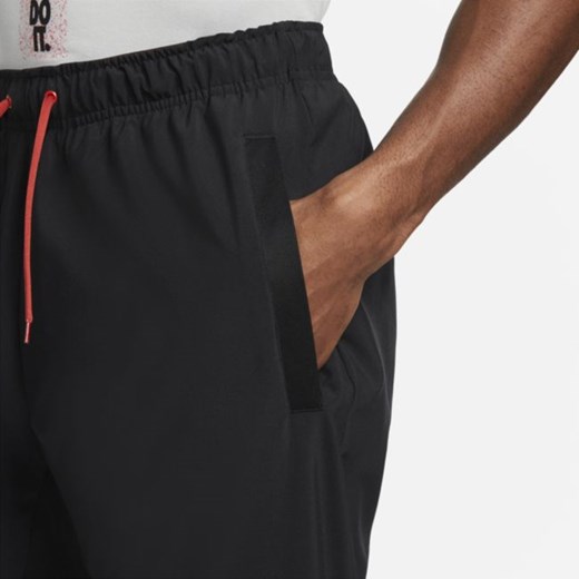 Męskie spodnie treningowe o zwężanym kroju Nike Dri-FIT - Czerń Nike L Nike poland