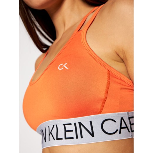 Calvin Klein Performance Biustonosz top Low 00GWF0K101 Pomarańczowy XS okazyjna cena MODIVO