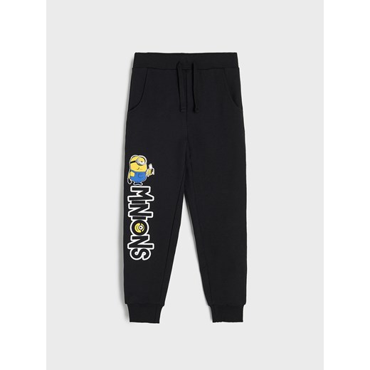 Sinsay - Spodnie dresowe jogger Minionki - Czarny Sinsay 116 Sinsay