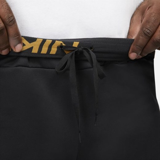 Męskie spodnie treningowe o zwężanym kroju ze wzorem moro Nike Therma-FIT - Nike M Nike poland okazja