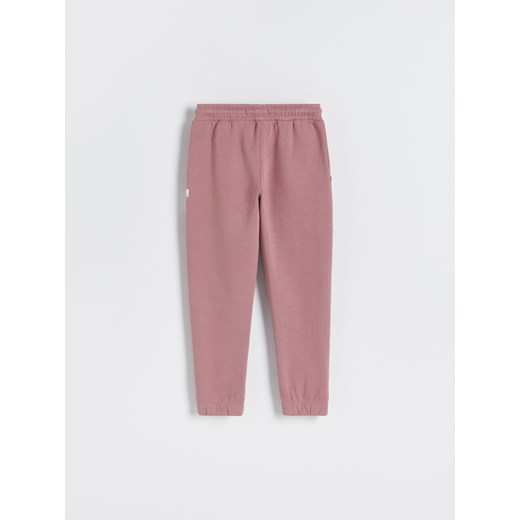 Reserved - Dresowe spodnie z naszywką - Różowy Reserved 170 Reserved