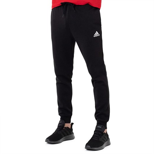 Spodnie adidas Essentials Fleece Regular Tapered HL2236 - czarne ze sklepu streetstyle24.pl w kategorii Spodnie męskie - zdjęcie 144512251