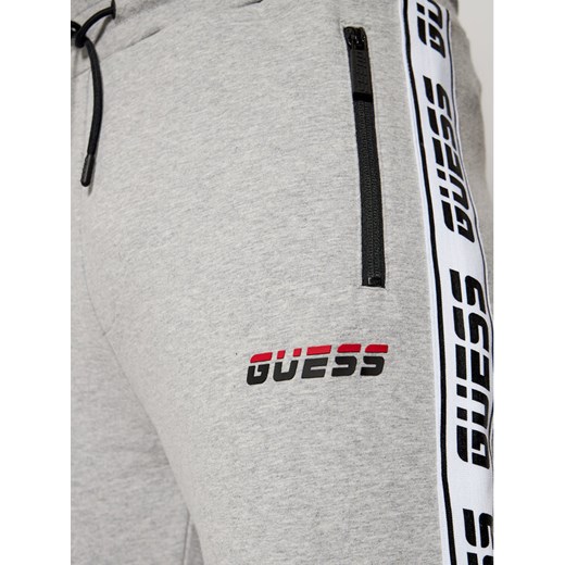 Guess Spodnie dresowe U0BA34 K6XF0 Szary Regular Fit Guess S promocyjna cena MODIVO