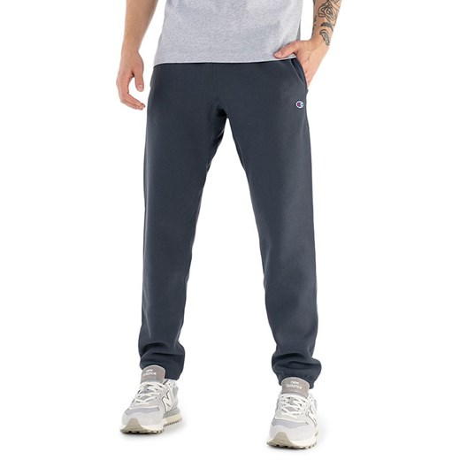 Spodnie Champion Elasticated Cuffs Reverse Weave Joggers 216540-BS551 - granatowe ze sklepu streetstyle24.pl w kategorii Spodnie męskie - zdjęcie 147003974