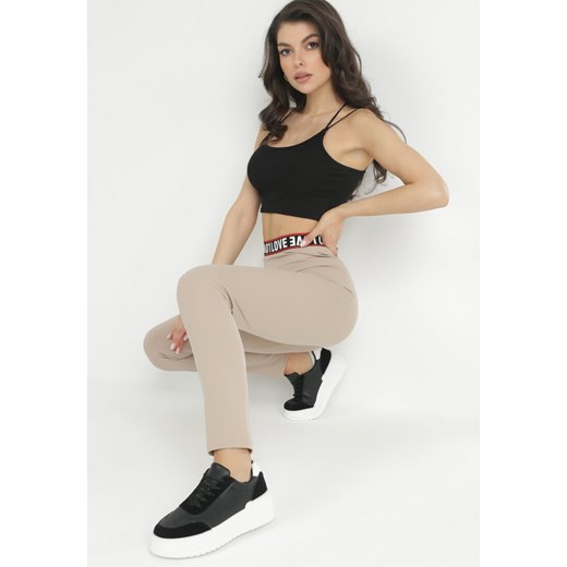 Jasnobeżowe Bawełniane Legginsy z Napisem na Gumce Hefote XL promocyjna cena Born2be Odzież