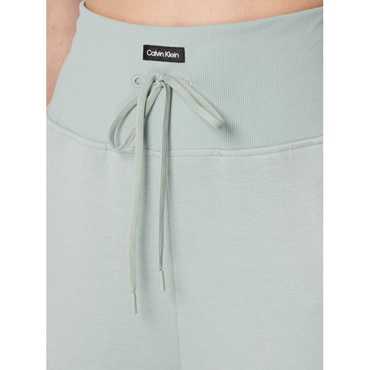 Calvin Klein Performance Spodnie dresowe 00GWF2P611 Zielony Slim Fit L MODIVO wyprzedaż