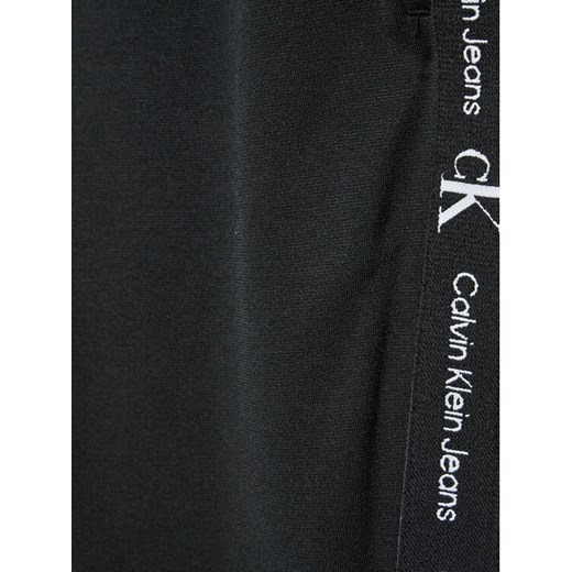 Calvin Klein Jeans Spodnie dresowe Punto Logo IB0IB01187 Czarny Regular Fit 16 promocja MODIVO