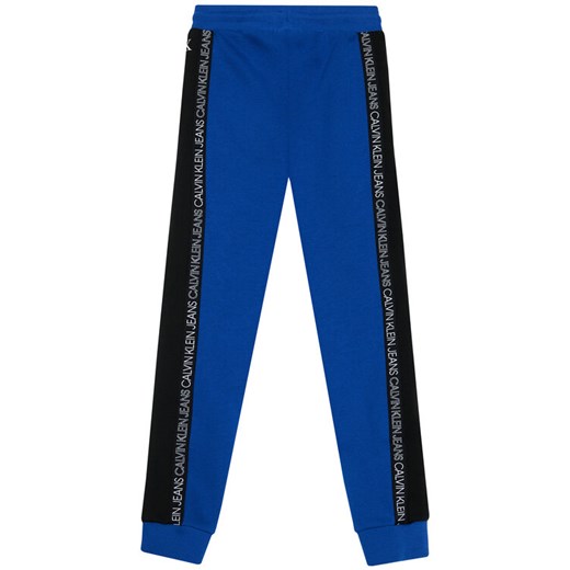 Calvin Klein Jeans Spodnie dresowe Colour Block IB0IB00866 Niebieski Regular Fit 14Y promocyjna cena MODIVO