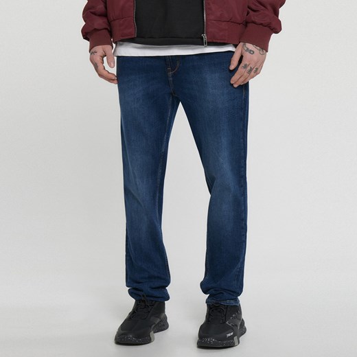 Cropp - Niebieskie jeansy slim - granatowy ze sklepu Cropp w kategorii Jeansy męskie - zdjęcie 151092692