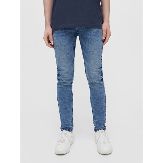 Jeansy skinny fit z regularnym stanem niebieskie - Niebieski House 28/30 House