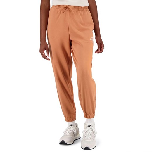 Spodnie New Balance WP31508SEI - pomarańczowe ze sklepu streetstyle24.pl w kategorii Spodnie damskie - zdjęcie 152394284