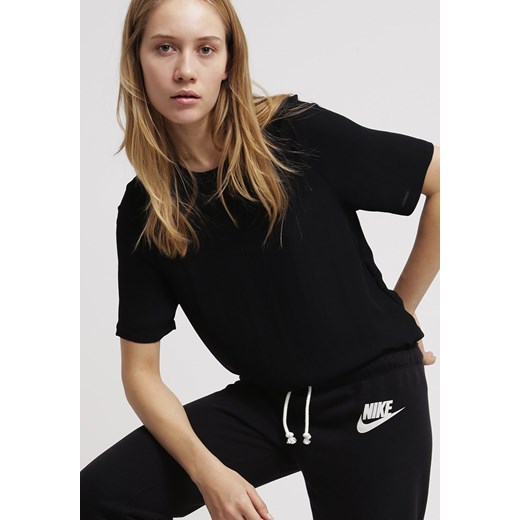 Nike Sportswear RALLY Spodnie treningowe black zalando czarny poliester