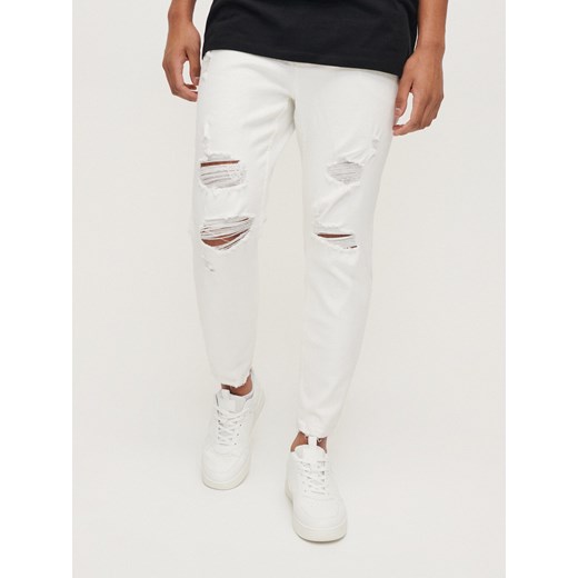 Białe jeansy slim fit z przetarciami - Biały House 34/34 House