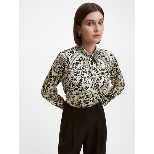 Reserved bluzka damska w abstrakcyjne wzory z długim rękawem z dekoltem v 