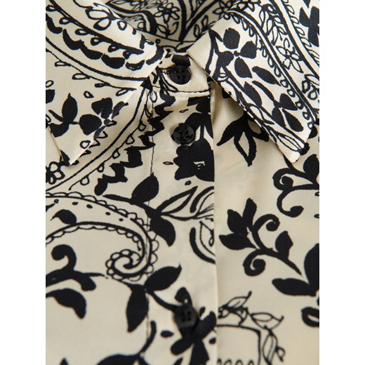 Bluzka damska Reserved w abstrakcyjne wzory z dekoltem v 
