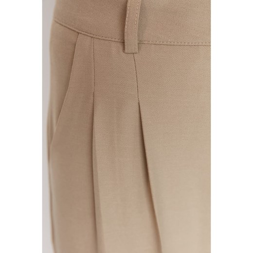 trendyol Spodnie w kolorze beżowym Trendyol 36 Limango Polska