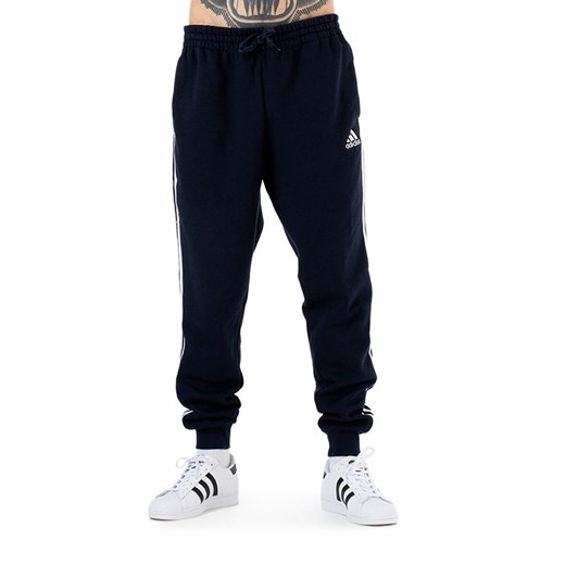 Spodnie adidas Essentials Fleece Fitted 3 Stripes GM1090 - granatowe ze sklepu streetstyle24.pl w kategorii Spodnie męskie - zdjęcie 159326430