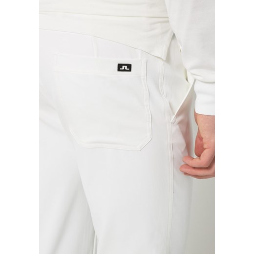 J.LINDEBERG TROON Spodnie materiałowe white zalando  Spodnie