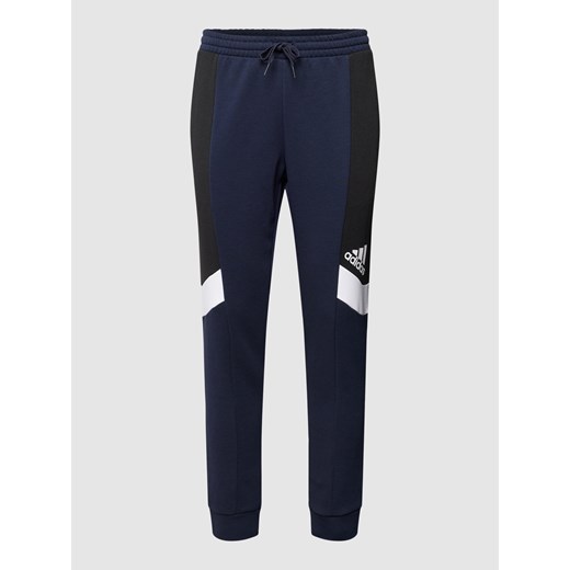 Spodnie dresowe z nadrukiem z logo Adidas Sportswear L wyprzedaż Peek&Cloppenburg 