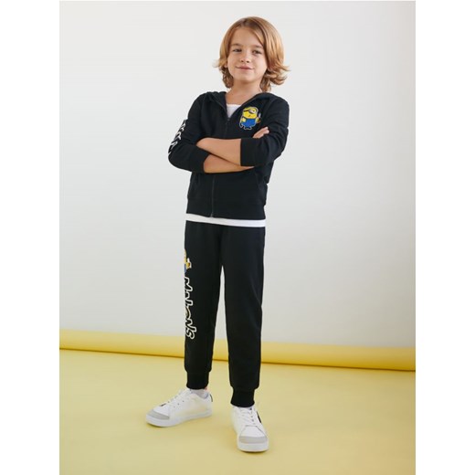 Sinsay - Spodnie dresowe jogger Minionki - czarny Sinsay 122 Sinsay