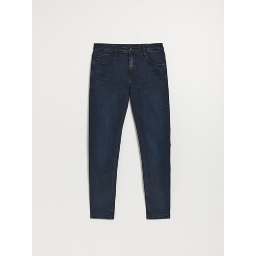 Ciemnogranatowe spodnie jeansowe slim fit - Niebieski House 36/32 House
