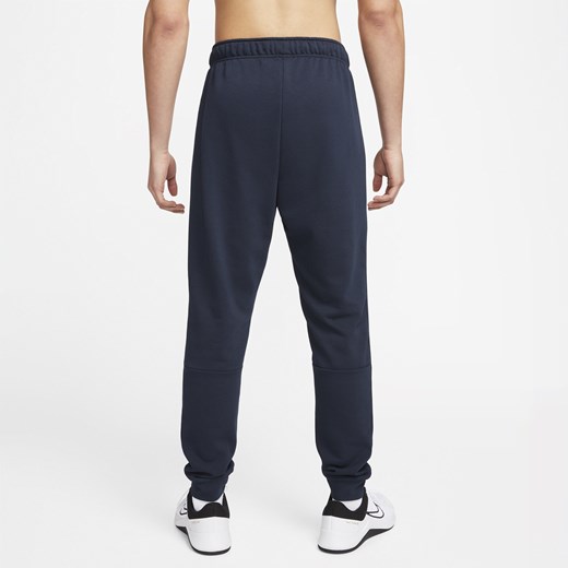 Męskie zwężane spodnie do fitnessu z dzianiny Dri-FIT Nike Dry - Niebieski Nike M Nike poland