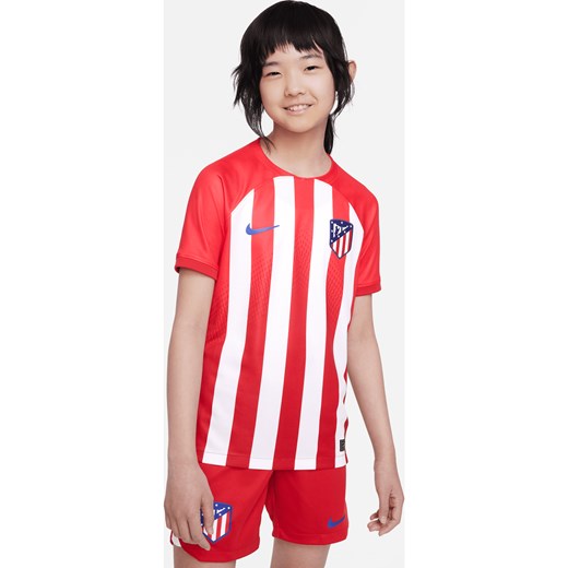 Koszulka piłkarska dla dużych dzieci Nike Dri-FIT Atlético Madryt Stadium 2023/24 (wersja domowa) - Czerwony ze sklepu Nike poland w kategorii Bluzki dziewczęce - zdjęcie 161610474