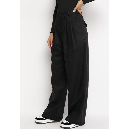 Czarne Szerokie Spodnie z Kieszeniami Zapinane na Haftkę Tuzette ze sklepu Born2be Odzież w kategorii Spodnie damskie - zdjęcie 162346562