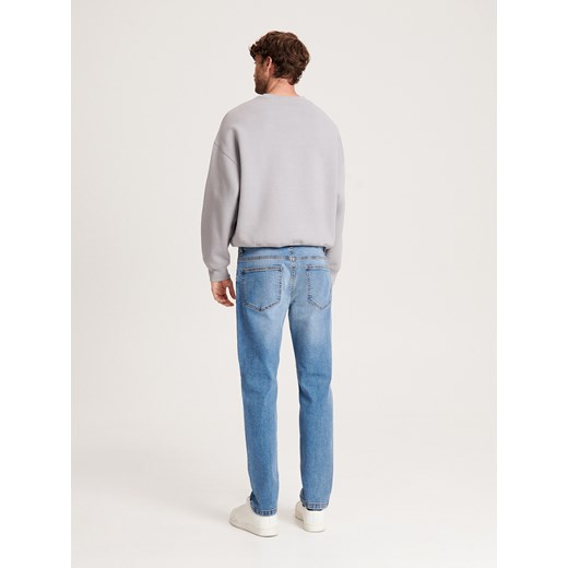 Reserved - Jeansy slim z efektem sprania - niebieski Reserved 34/34 Reserved
